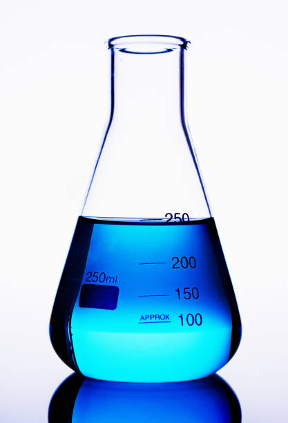 istock Laboratory glass flask holding blue liquid 649377346