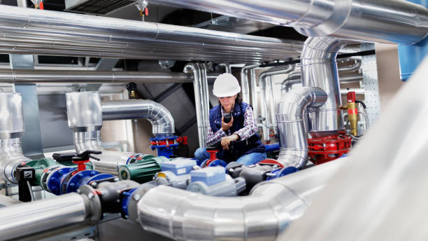 istock Woman working in the boiler room 649377516