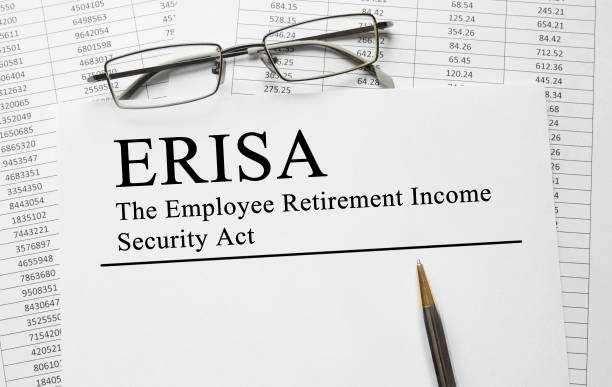 istock Paper with Employee Retirement Income Security Act ERISA on a table 649379708