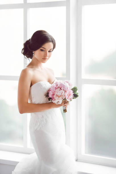 istock Stunning young bride holding bouquet 649379734