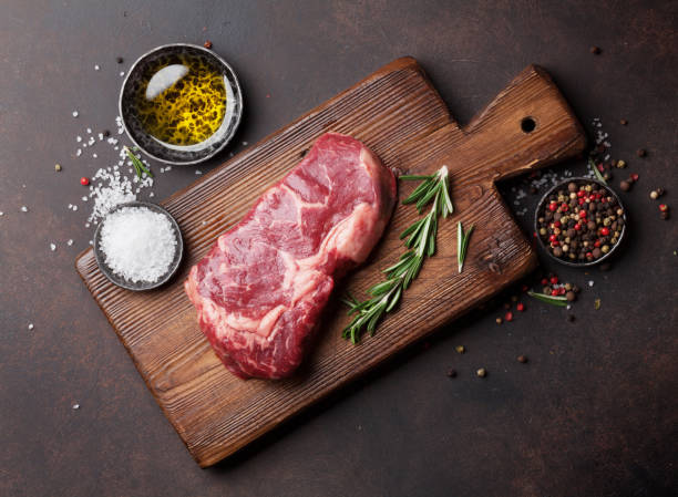 istock Raw ribeye beef steak cooking with ingredients 649380994