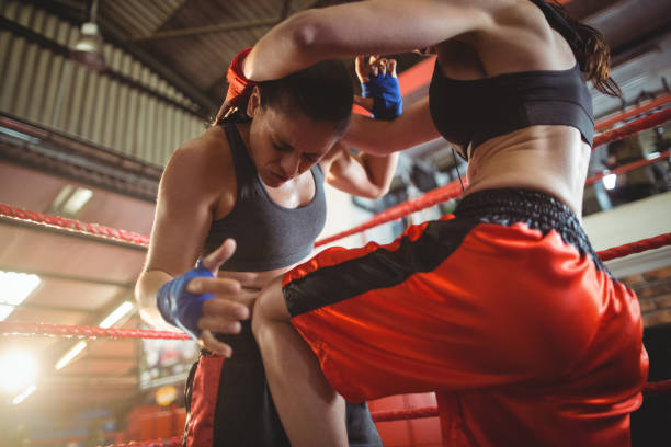 istock Female boxers fighting in boxing ring 649394516
