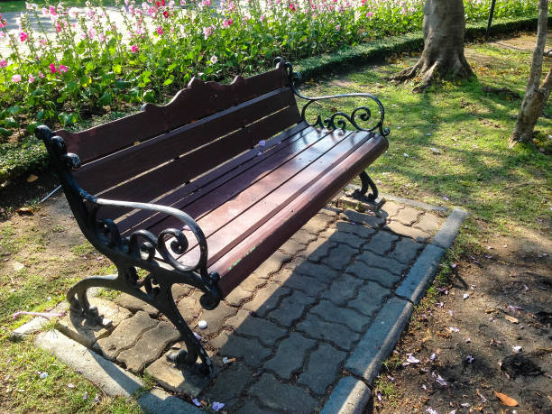 istock Dark brown wooden bench 649418298