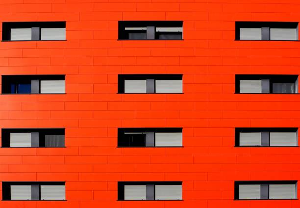 Orange facade anf grey windows of an apartment building