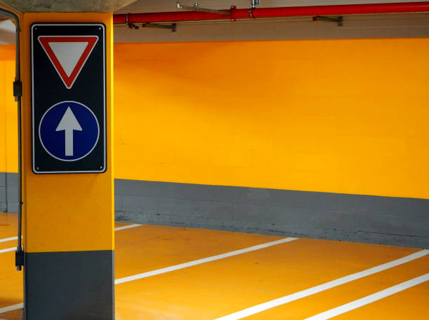 istock Street signs in a yellow parking 649423902