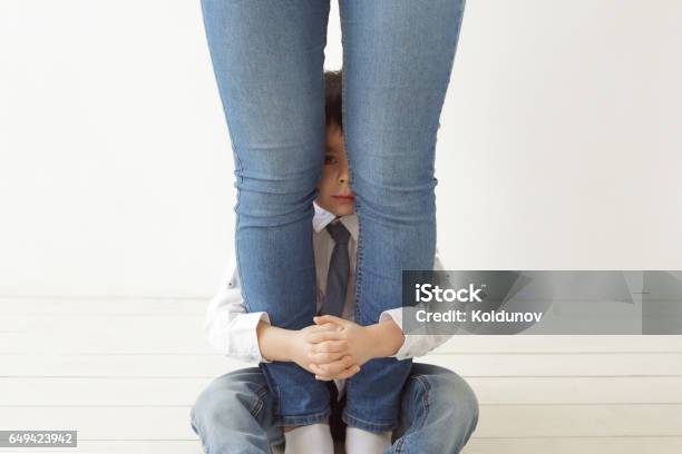 Defend And Hold The Child Out Of Trouble Stock Photo - Download Image Now - Child, Shy, Hiding