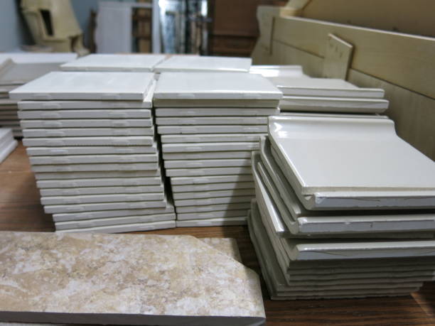 istock Overstock Remnants Retail Stacks of White Square Ceramic Tiles 649423950