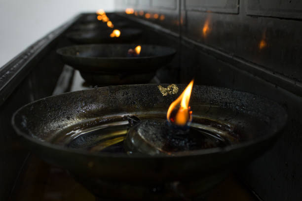 istock closeup of burning candles in pot 649429880