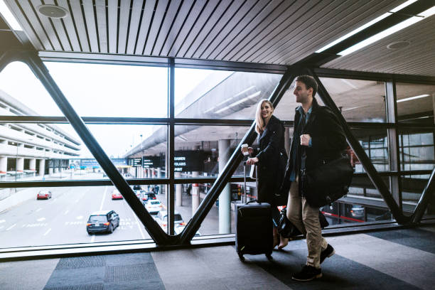 istock Couple Leaving Airport Terminal 649434342