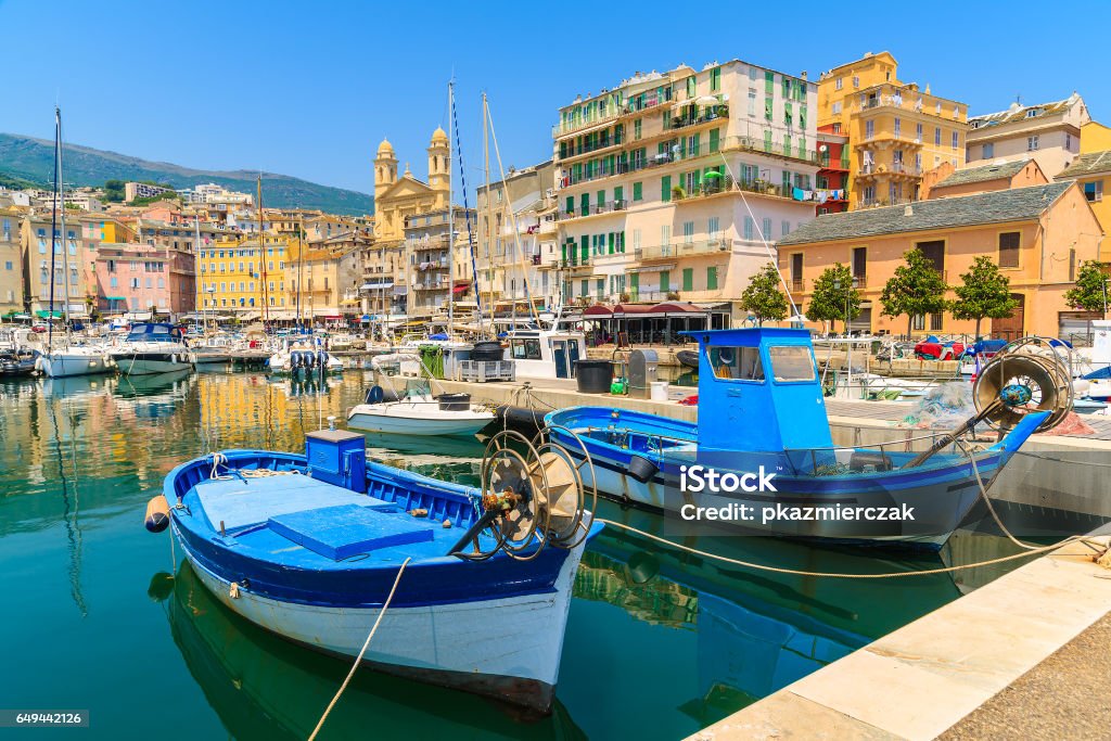 Traditional fishing boats in Bastia port on sunny summer day, Corsica island, France Corsica is the largest French island on Mediterranean Sea and most popular holiday destination for French people. Bastia Stock Photo