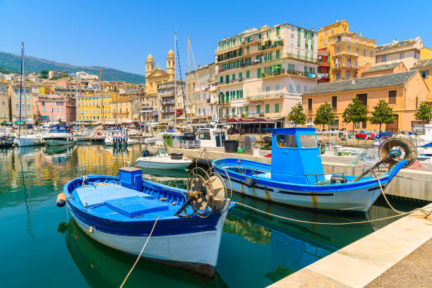 Traditional fishing boats in Bastia port on sunny summer day, Corsica island, France Corsica is the largest French island on Mediterranean Sea and most popular holiday destination for French people. corsica photos stock pictures, royalty-free photos & images