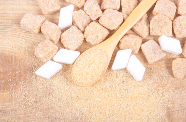 istock Cubes of sugar - brown sugar cane. 649442292
