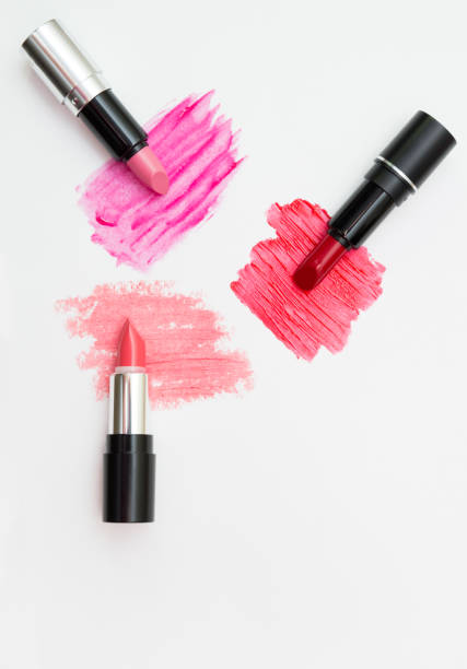 istock Three lipsticks of different color with swatches. View from above 649442334