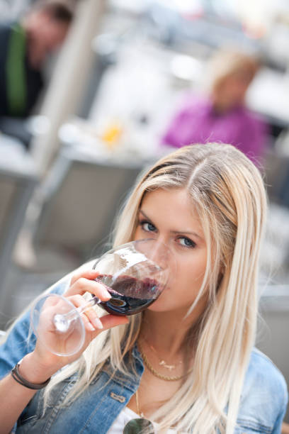 istock Drinking red wine in outdoor cafe 649445366