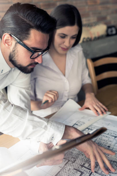 istock Young startup business couple working 649447674