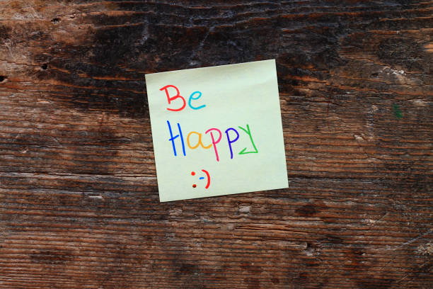 istock Motivation message Be happy on wooden table 649447928