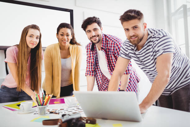 istock Portrait of happy editors at creative office 649457324