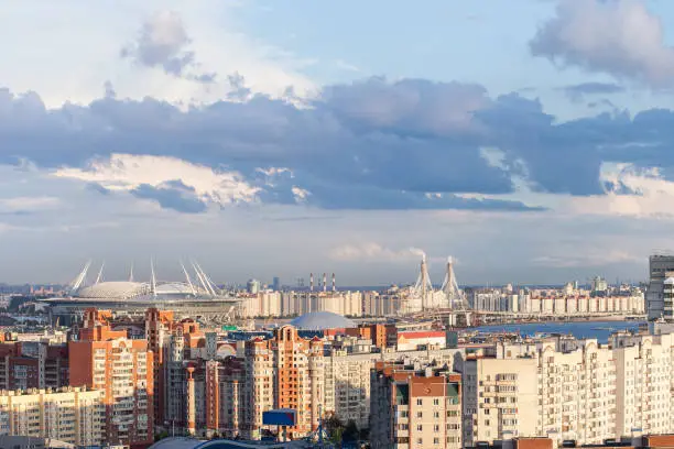 Urban View on New Stadium in Saint-Petersburg Russia constructed for events like FIFA World Cup 2018 UEFA Euro 2020 FIFA Confederations Cup 2017 and other events Rainy weather clouds and Rainbow