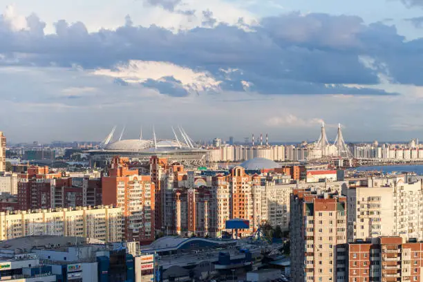 Urban View on New Stadium in Saint-Petersburg Russia constructed for events like FIFA World Cup 2018 UEFA Euro 2020 FIFA Confederations Cup 2017 and other events Rainy weather clouds and Rainbow