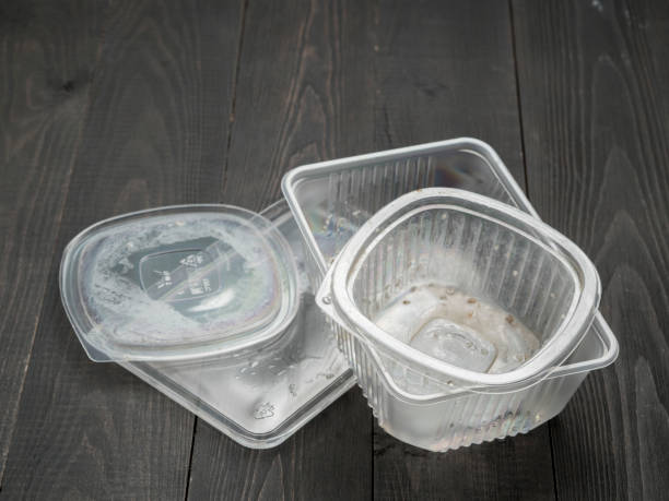 istock Dirty plastic food container on dark wooden background 649466902
