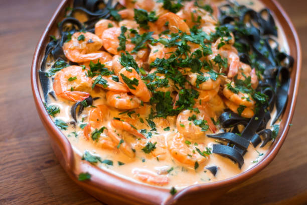 istock Black Spaghetti With Fresh Shrimps 649470570