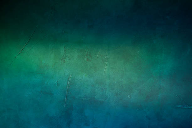 istock green and blue textured background with spotlight 649470874