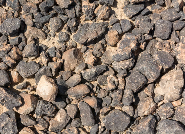 istock Textured surface of desert rocks 649477200