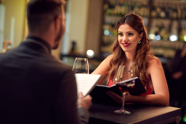 istock Girlfriend with boyfriend in restaurant 649485188