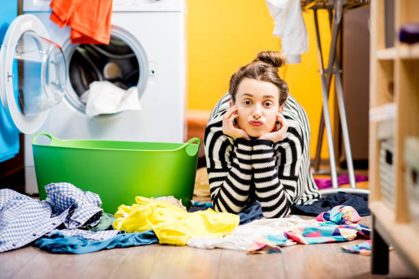 istock Woman washing clothes at home 649488806