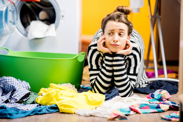 istock Woman washing clothes at home 649488856