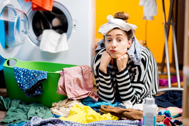 istock Woman washing clothes at home 649489878
