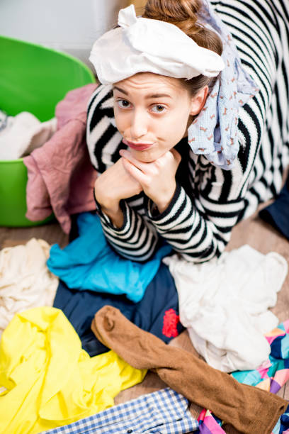istock Woman washing clothes at home 649490114