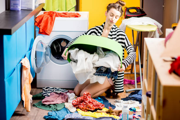 istock Woman washing clothes at home 649495502
