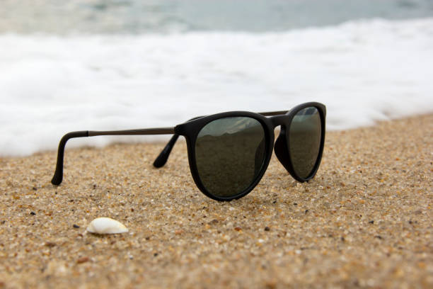 istock Sunglasses at the edge of the beach. 649502890