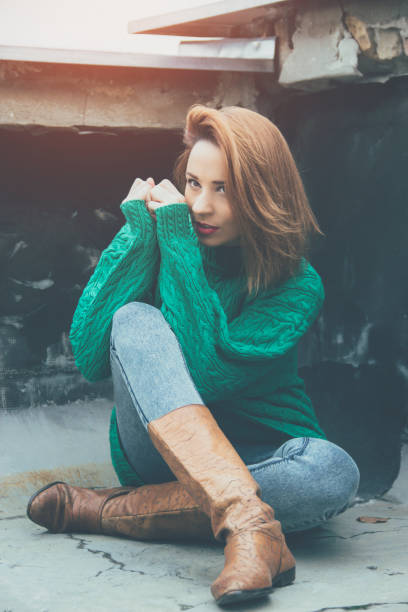 istock woman wearing green sweater 649503728