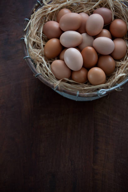 istock Top View of Fresh Farm Chicken Eggs in Wire Basket 649511764