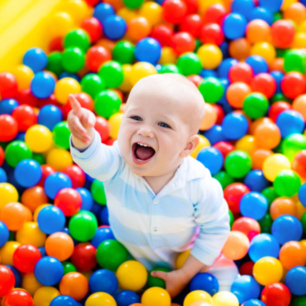 istock Child playing in ball pit on indoor playground 649515052