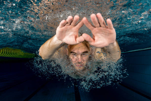 istock Young swimmer swimming in a pool underwater 649515766