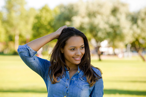 Outdoor portrait of a beautiful African American woman in the park