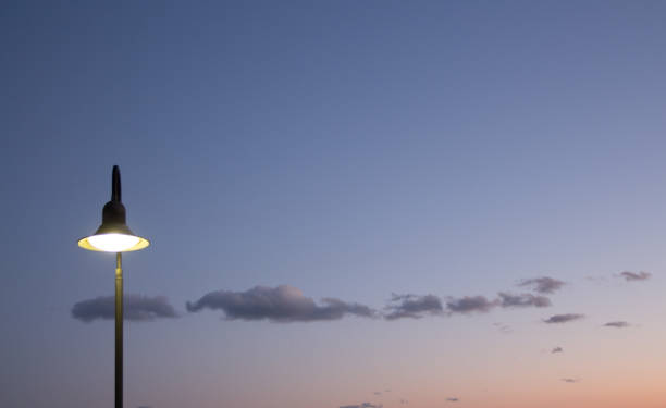istock Outdoor public light shining against night sky 649518380