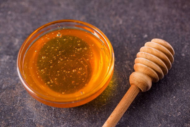 istock sweet natural honey in glass jar on table 649521006