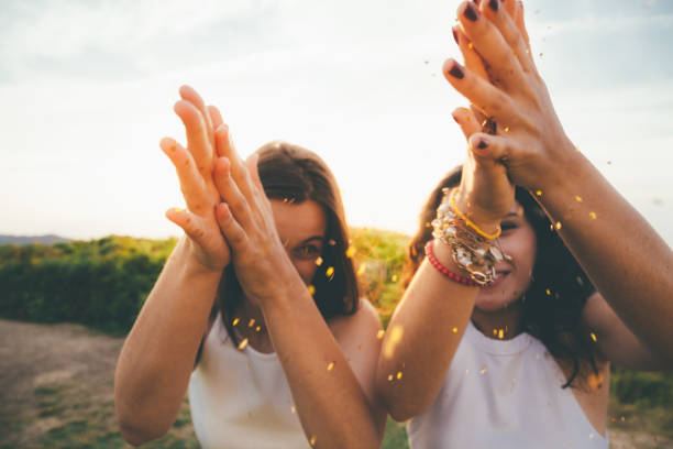istock Girls spreading glitter 649524662