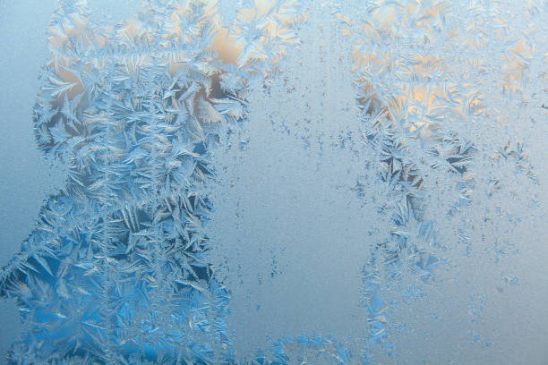 istock beautiful winter texture patterns of frost on window 649525400