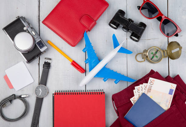 istock plane, passport, money, camera, compass, sunglasses, binoculars, jeans 649529054