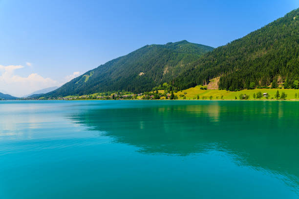 istock Green water Weissensee lake in Alps Mountains, Austria 649529154