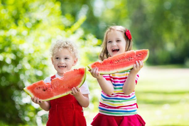 istock Kids eating watermelon in the garden 649545880
