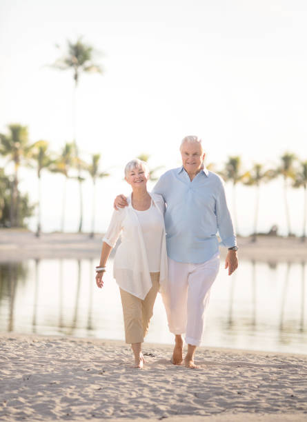 istock Senior couple walking at the beach 649546956