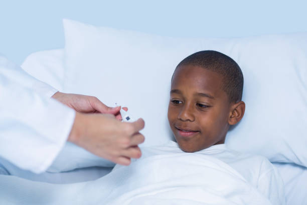 istock Female doctor checking fever from digital thermometer 649549656