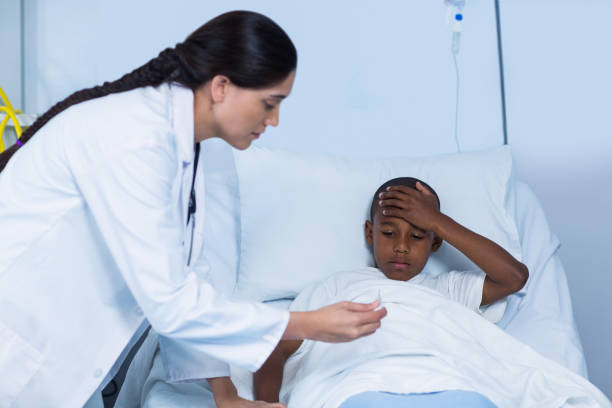 istock Female doctor checking fever from digital thermometer 649549668