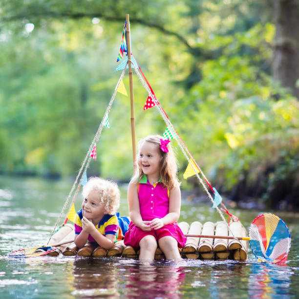 istock Kids on wooden raft 649551898